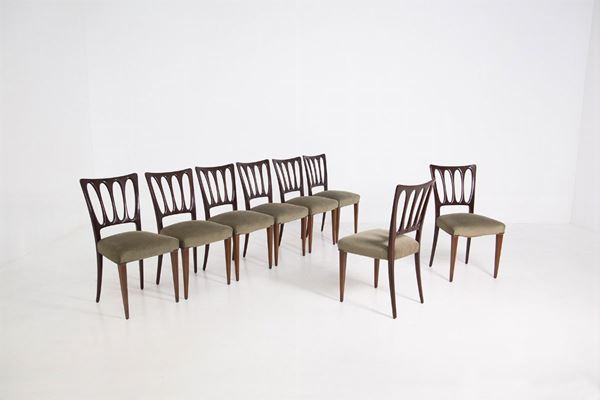 Eight green velvet chairs