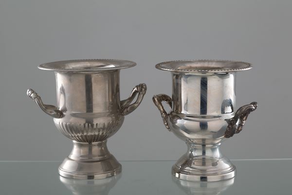 Two champagne holders in silver-plated metal