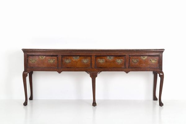 Servante in legno di rovere con quattro cassetti. Inghilterra o Scozia. Inizi X...