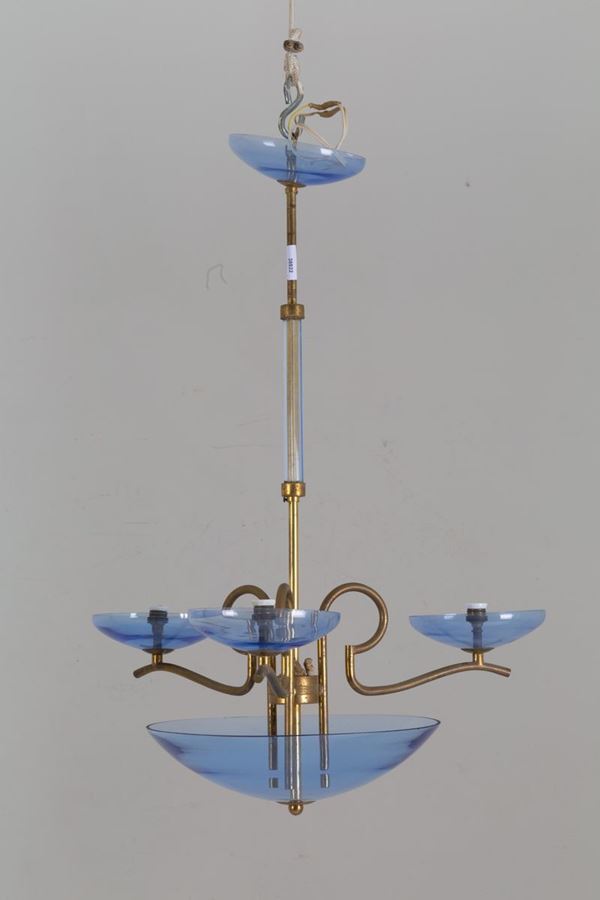 Lampadario in ottone e vetro azzurro. Manifattura italiana. Anni '50....