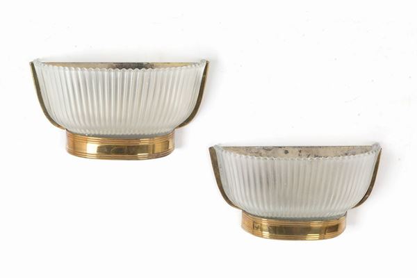 Coppia di applique in vetro di Murano e ottone. Produzione SEGUSO. Anni '50...