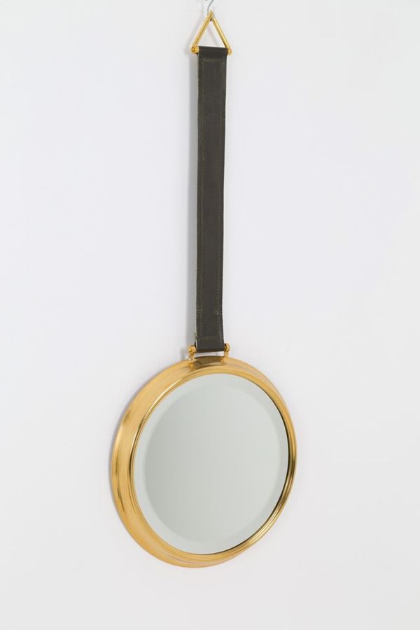 Round mirror in brass with leather buckle