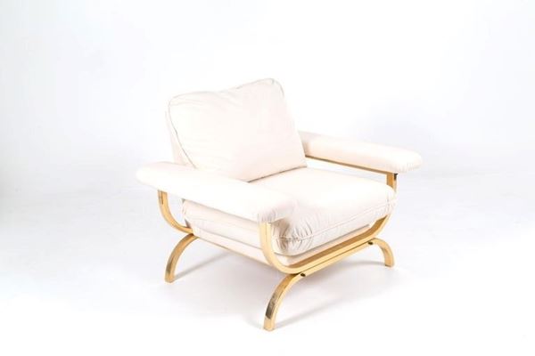 Armchair in golden brass