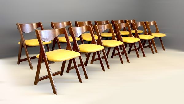 Twelve chairs in wood and leather