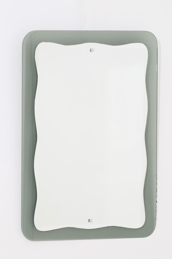 Mirror in shaped glass