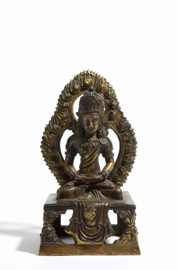 Buddha with halo in bronze