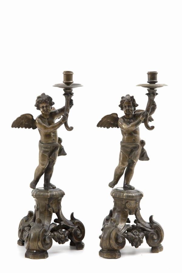 Pair of candlesticks with angels