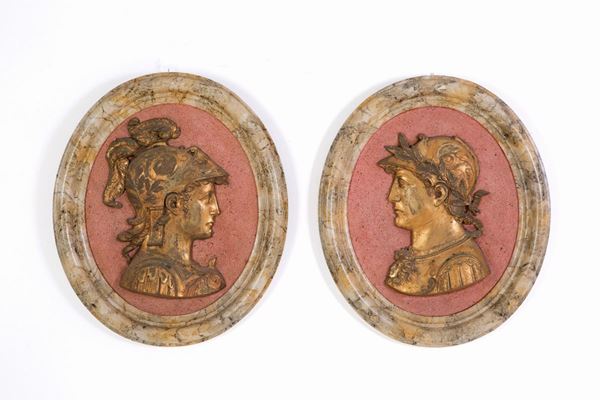 Pair of oval resin medallions