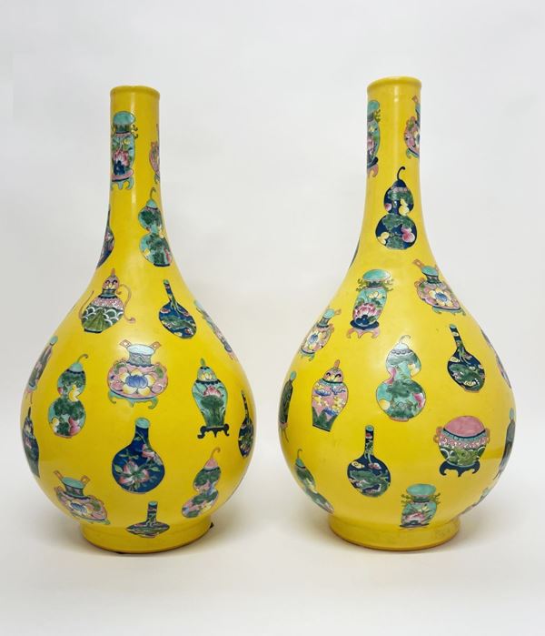 Pair of vases with a yellow background