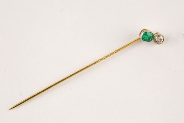 Tie clip with diamond and emerald