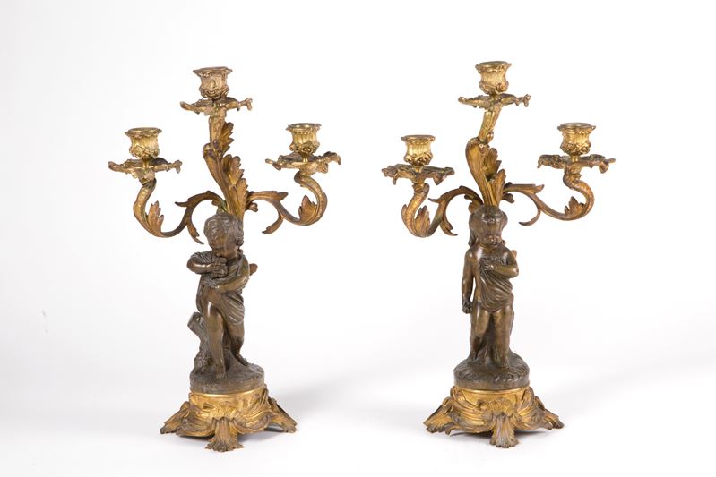 Coppia di candelieri in bronzo