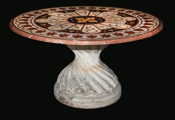 Tavolo in pietra e piano in marmo