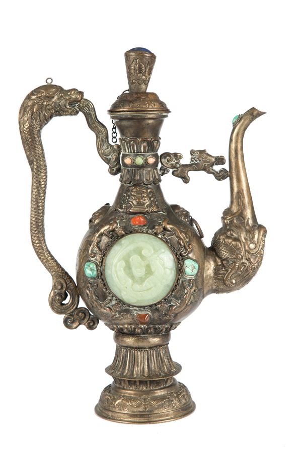 Silver pourer with plaques