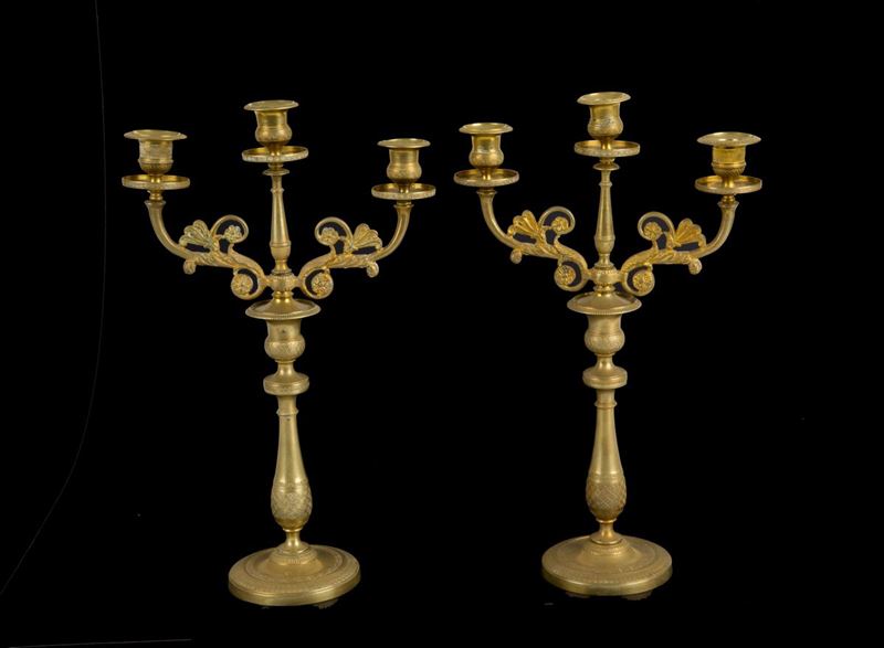 Coppia di candelabri a tre luci