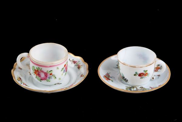 Pair of glass cups and saucers