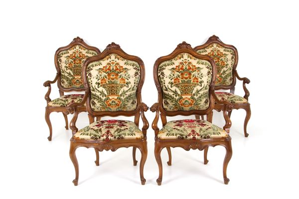 Four walnut armchairs