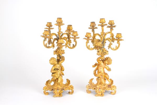 PHILIPE H. MOUREY - Pair of bronze candlesticks