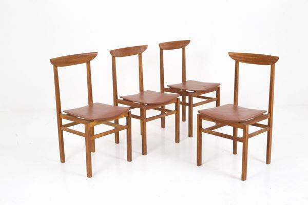Four wooden chairs and sky