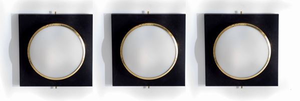 Three square ceiling lights with one spotlight