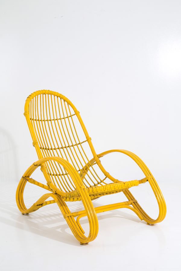 Yellow rattan armchair