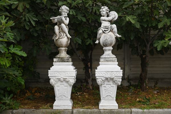 Coppia di sculture "PUTTI SUONATORI"