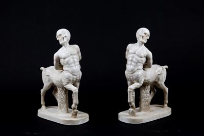 Coppia di Sculture in Marmo “centauri con Teschi”