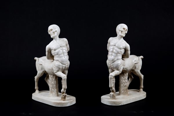 Pair of marble sculptures “CENTAURS WITH SKULLS”