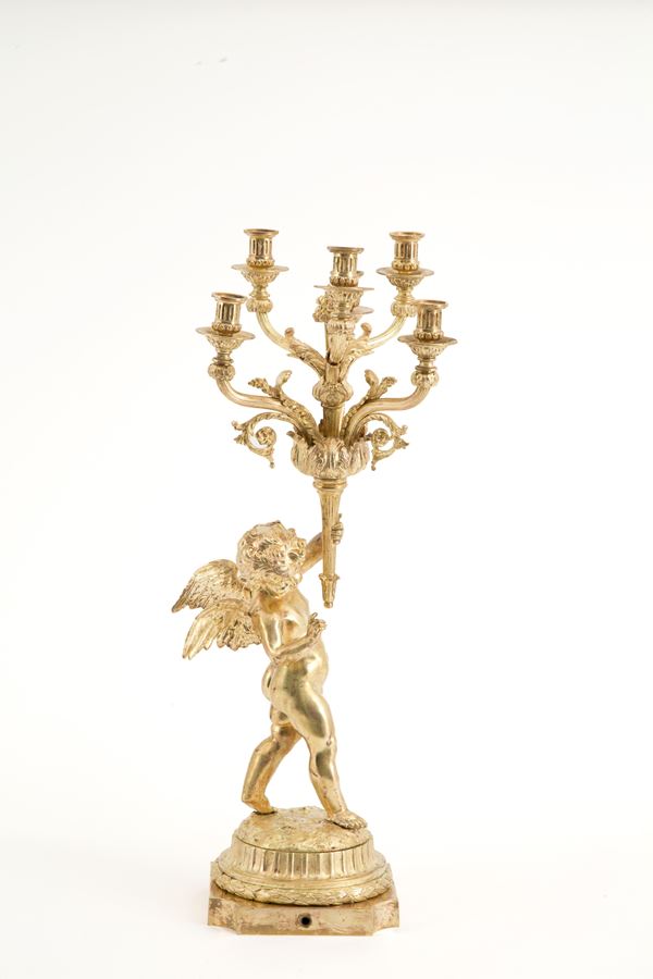 Candelabro con putto in bronzo dorato