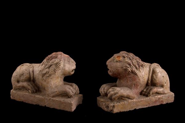 Pair of sculptures "CROUCHING LIONS"