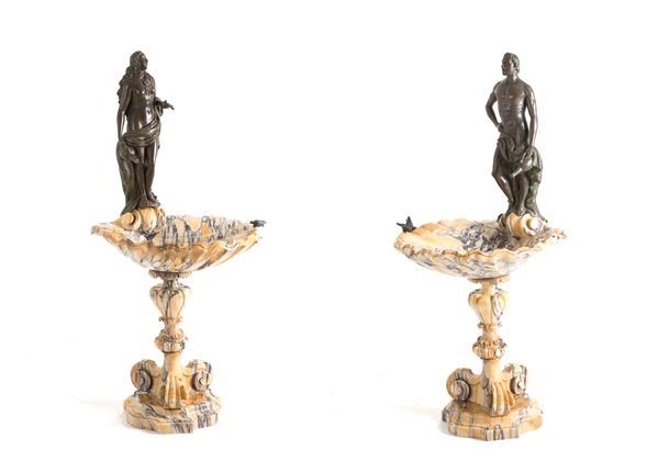 Pair of marble basins with figures