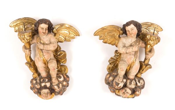 Pair of candle-holding angels