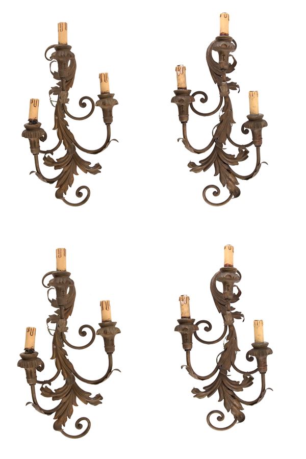 Four three-light wall lamps