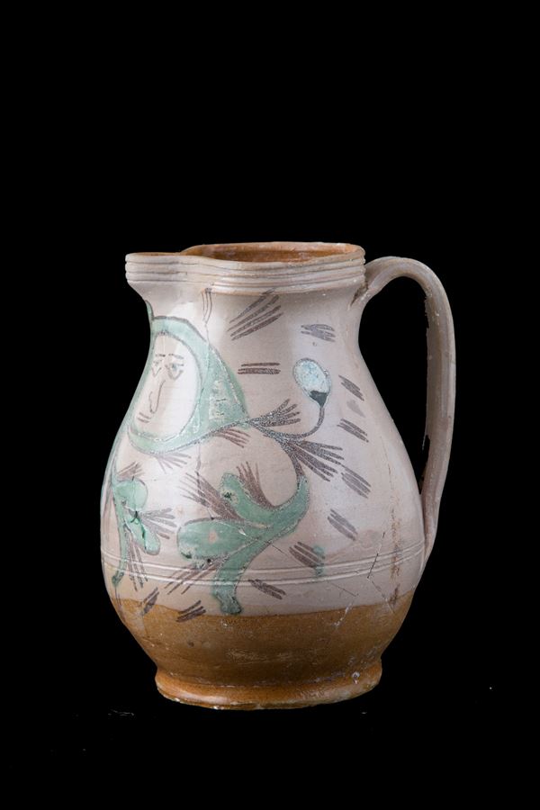 Majolica jug with face among the vines