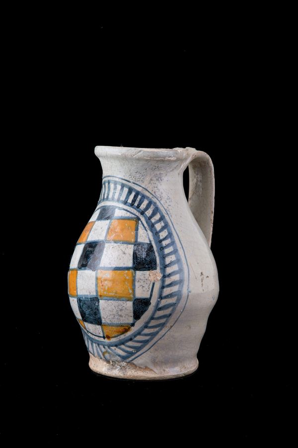 Majolica jug with checkerboard decoration