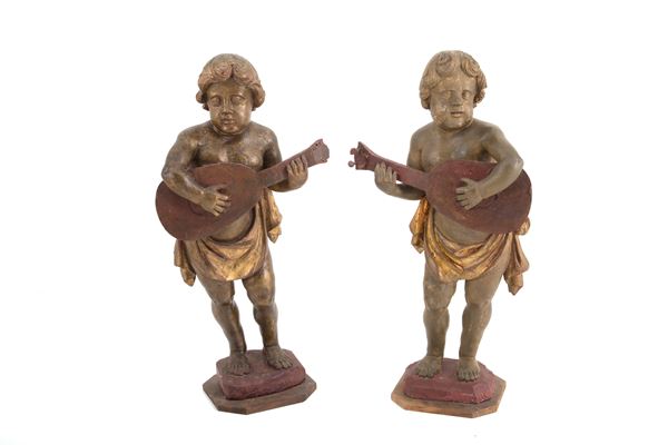 Coppia di sculture "PUTTI MUSICANTI"