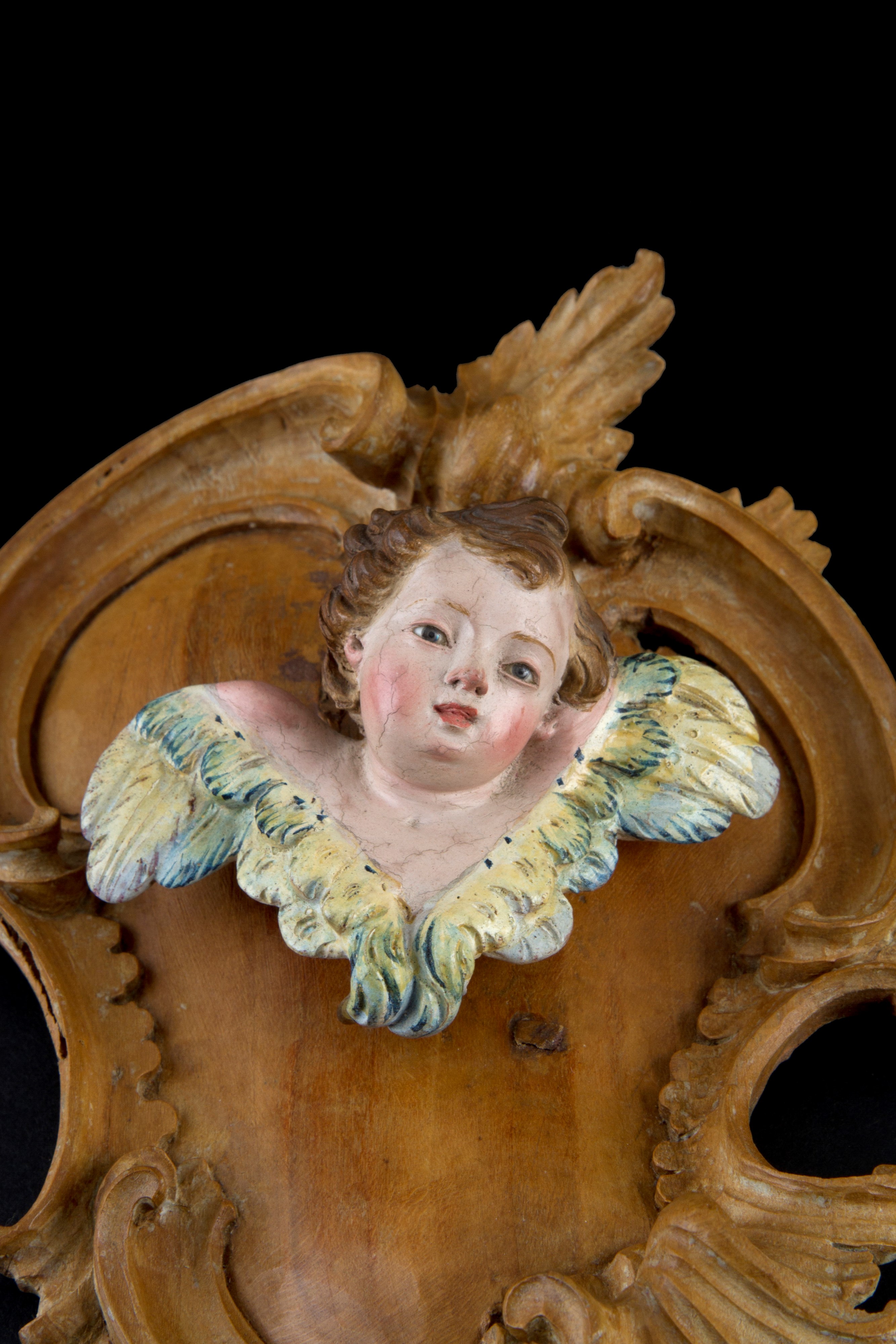 Coppia di cherubini in legno