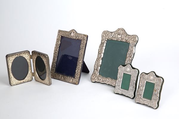 Five silver photo frames