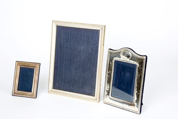 Three silver photo frames