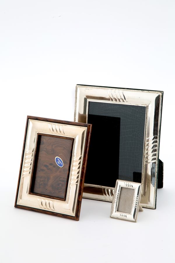 Three silver photo frames