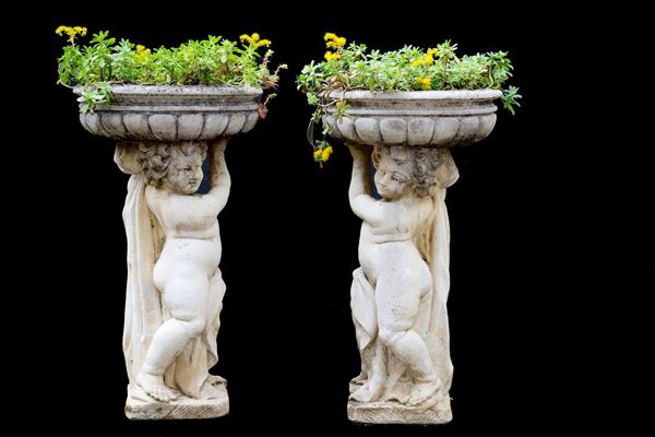 Pair of flowerpots with cherubs