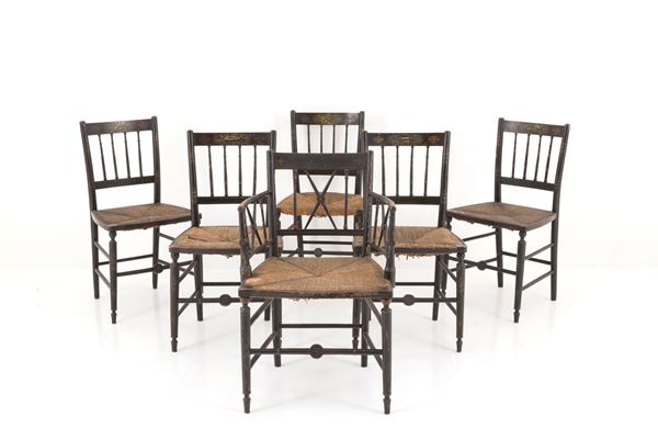 An armchair and five lacquered chairs