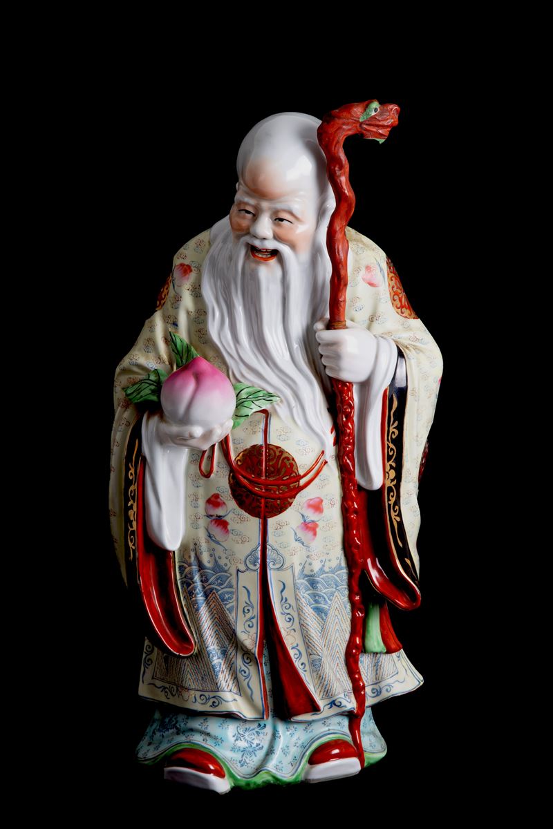 Scultura in porcellana "BUDDHA CON PESCA SACRA"