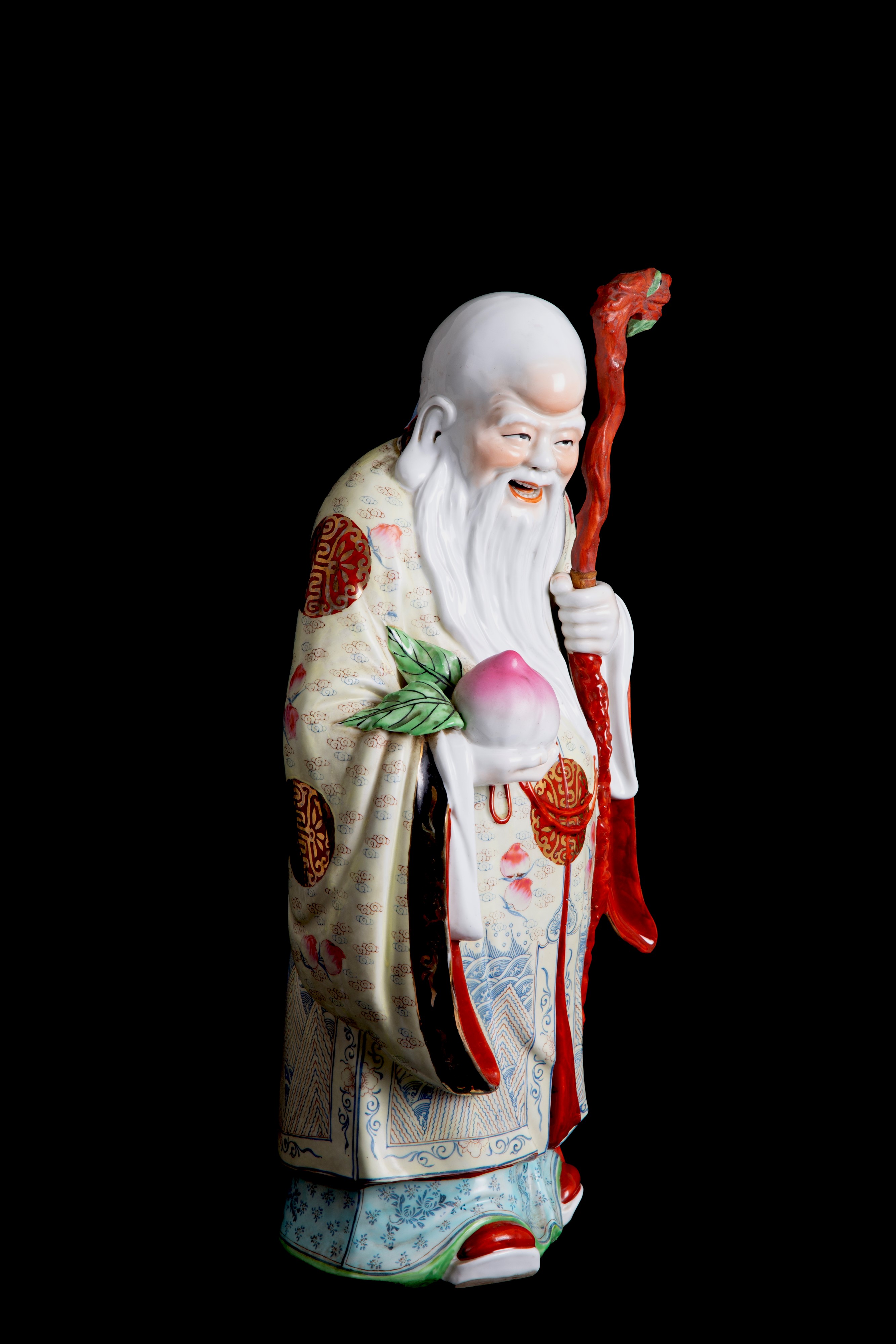 Scultura in porcellana "BUDDHA CON PESCA SACRA"