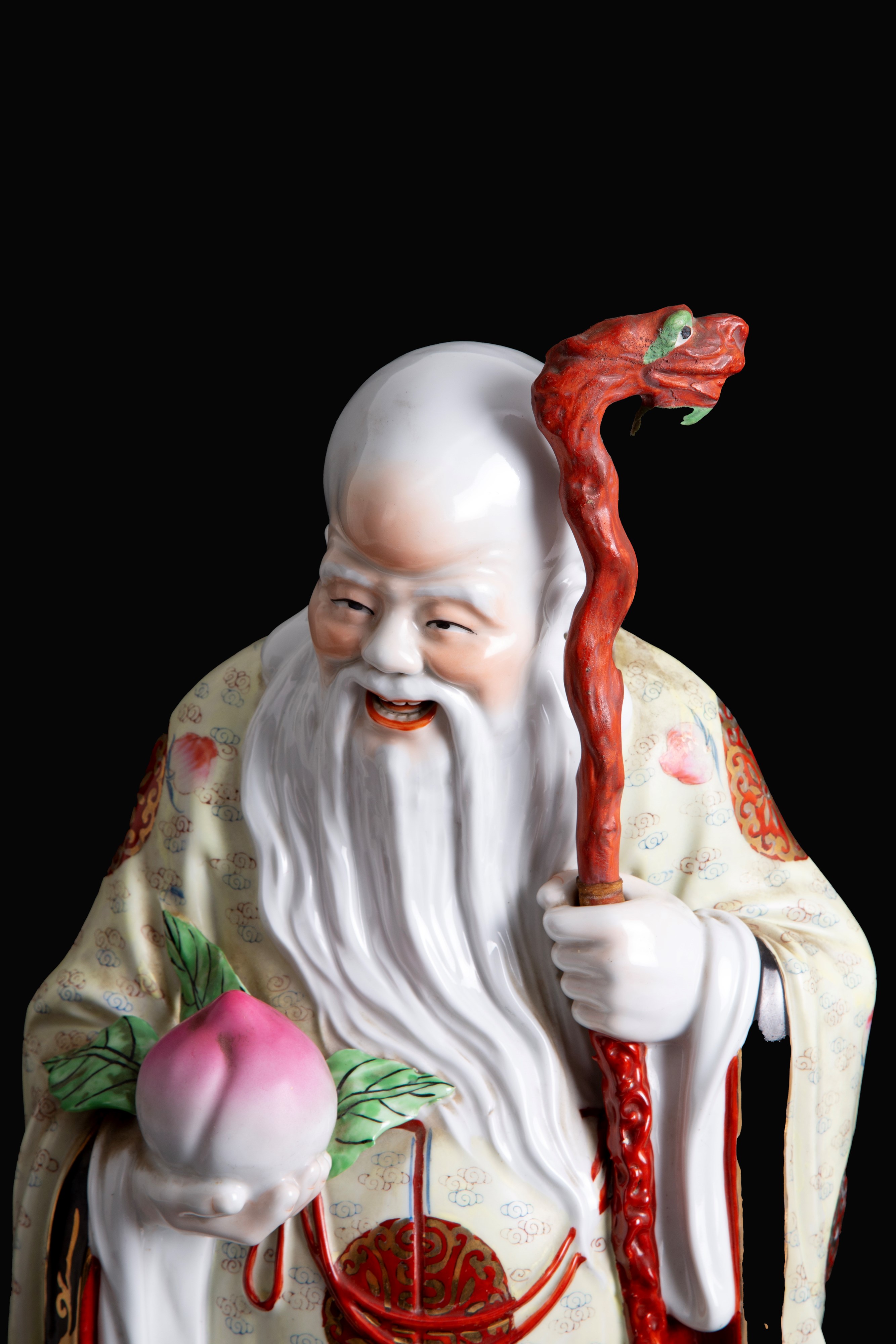 Scultura in porcellana "BUDDHA CON PESCA SACRA"