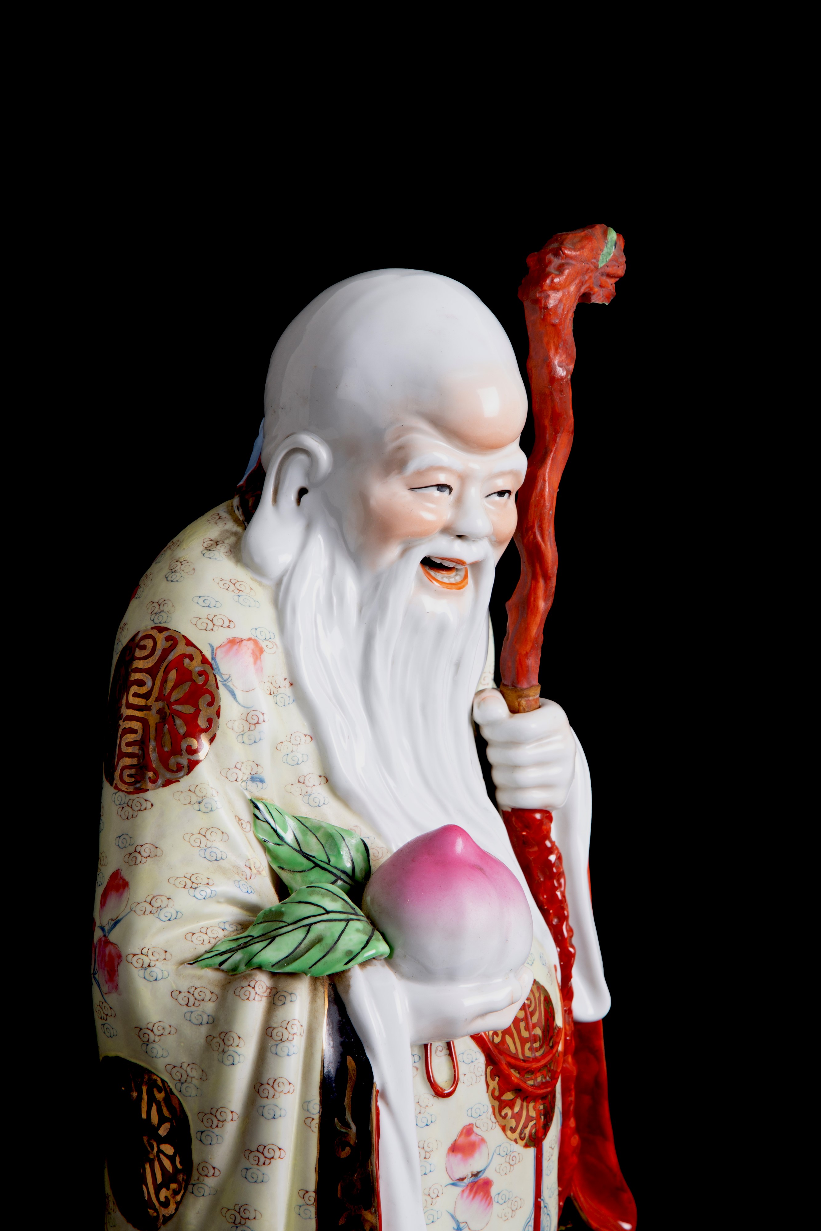 Scultura in porcellana "BUDDHA CON PESCA SACRA"