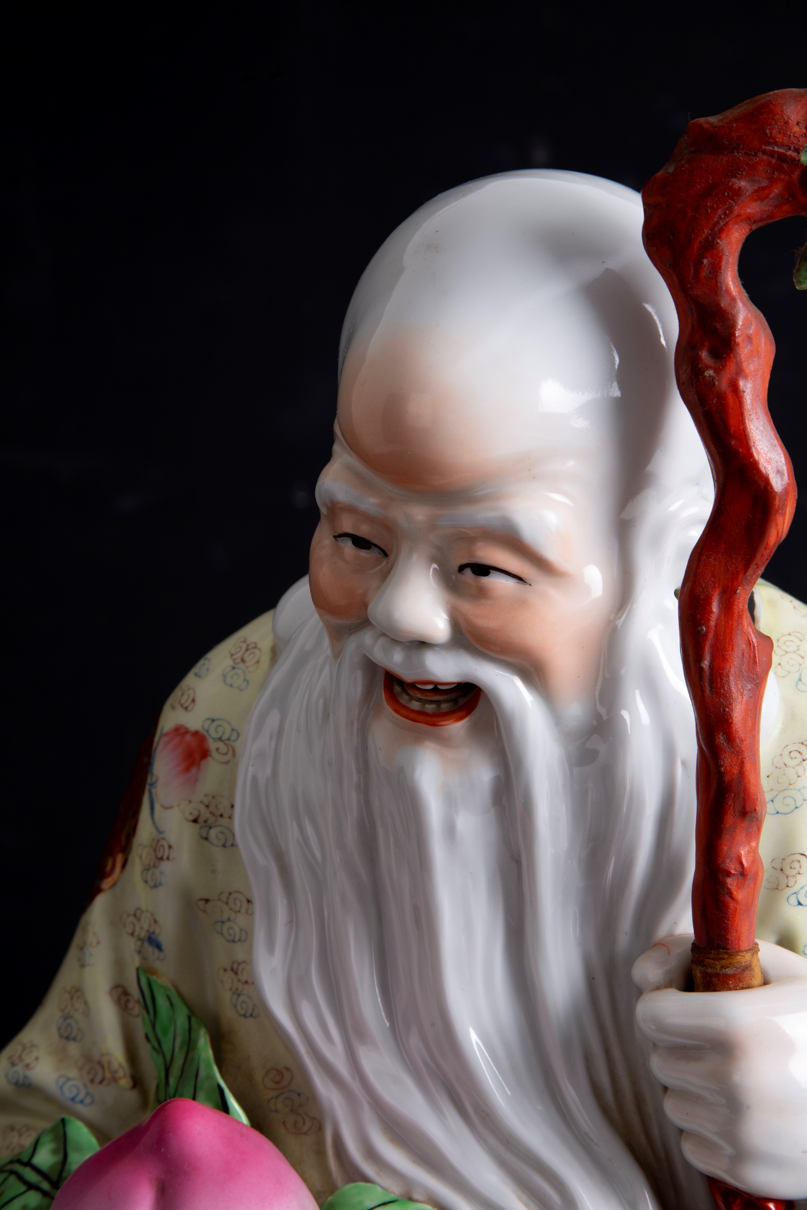 Scultura in porcellana "BUDDHA CON PESCA SACRA"