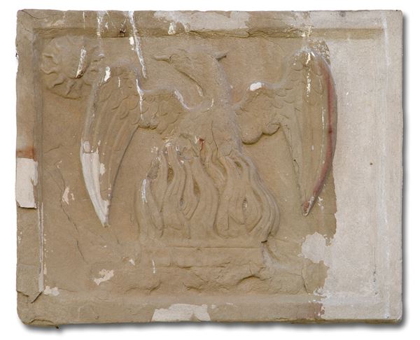 Lastra in pietra con aquila e fiamme