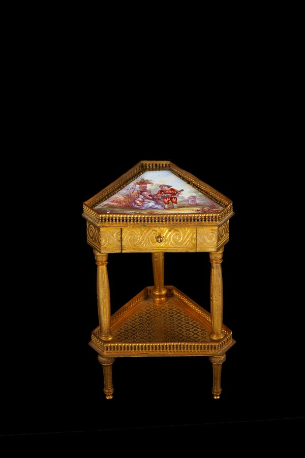 Model of a triangular brass table