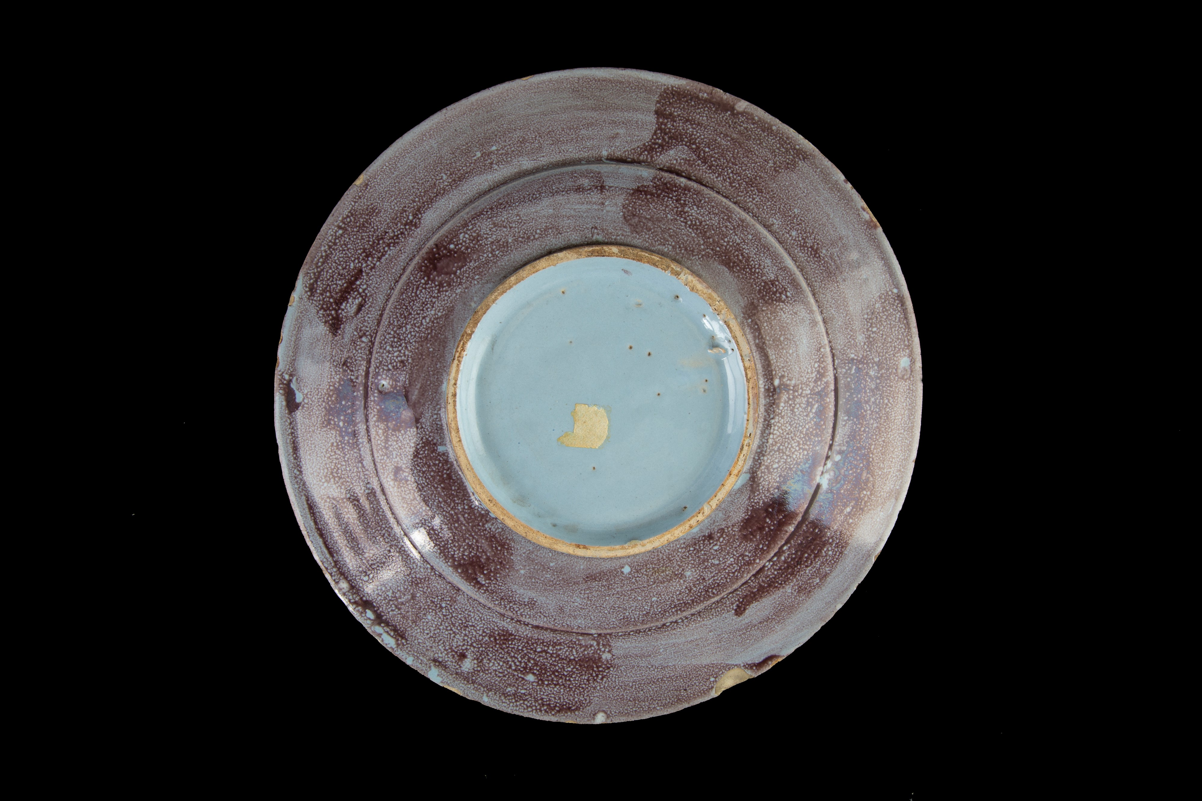 Piattino con paesaggio con architetture