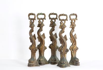Cinque fermaporte in bronzo parzialmente dorato a forma di tritoni, XX secolo